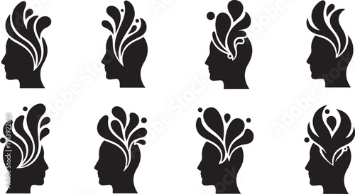 Silhouette of human heads with floral designs growing out