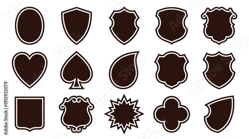 Collection of dark brown shield shapes and emblem templates in various classic and ornate styles, including heart, spade, and starburst forms for creating custom logos or badges