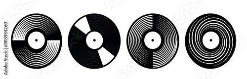 Four black vinyl record icons with stylized graphic patterns are arranged in a horizontal row, representing retro audio media and minimalist musical design elements