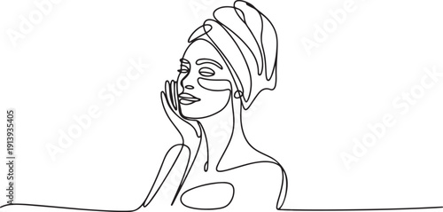 Continuous one single line drawing Woman with a towel on her head takes care of her facial skin.one line vector illustration with white background