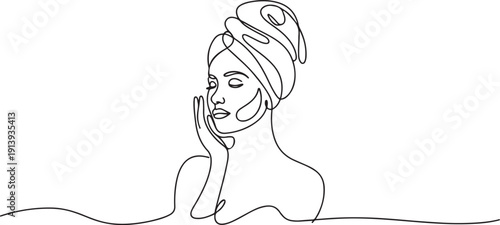 Continuous one single line drawing Woman with a towel on her head takes care of her facial skin.one line vector illustration with white background