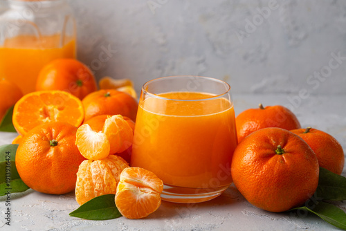Glass of fresh tangerine ju...