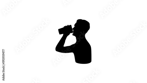 A man drinks a drink from a glass , black isolated silhouette