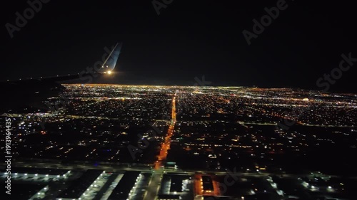 Beautiful view of Las Vegas city lights at night seen from airplane window during flight. USA.