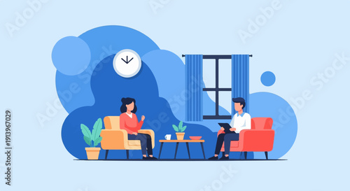 Two people sitting on couches in a room, one holding a tablet