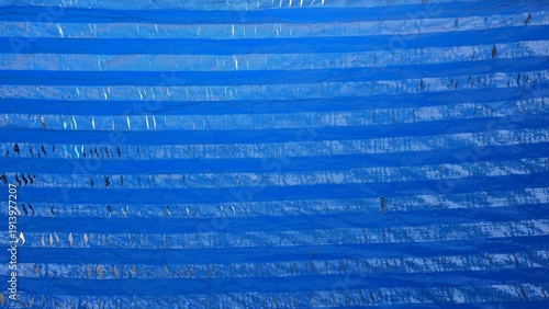 Canvastavla Old damaged blue tarp texture with dirt and rips
