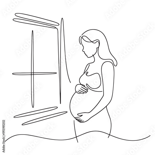 Pregnant woman standing by window looking down belly