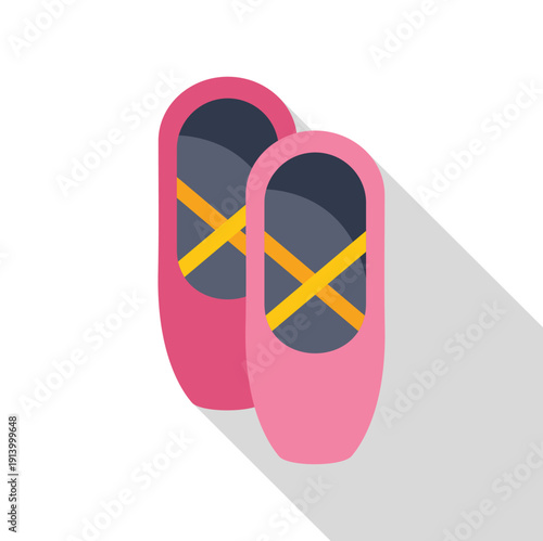 Pair of pink pointe shoes with yellow ribbons for dancing