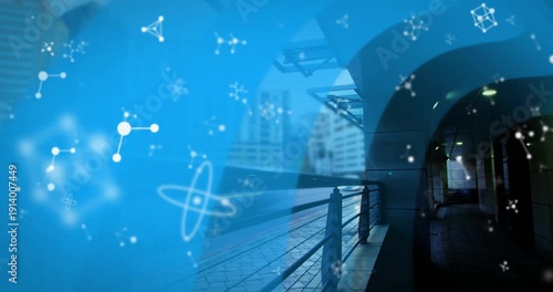 Animation of molecules over train station and cityscape