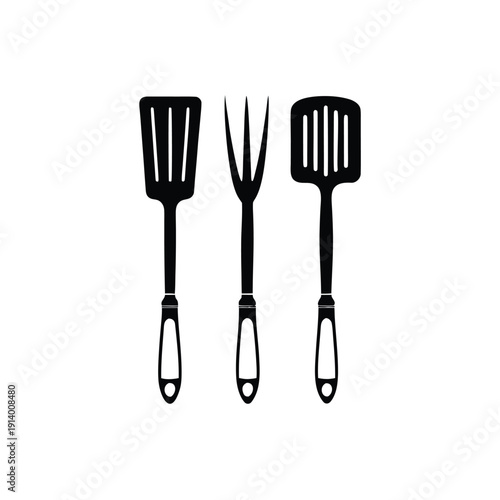 Three black kitchen utensils including spatula, fork, and turner on white background