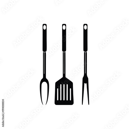 Three Black Kitchen Utensils on White Background spatula tongs fork