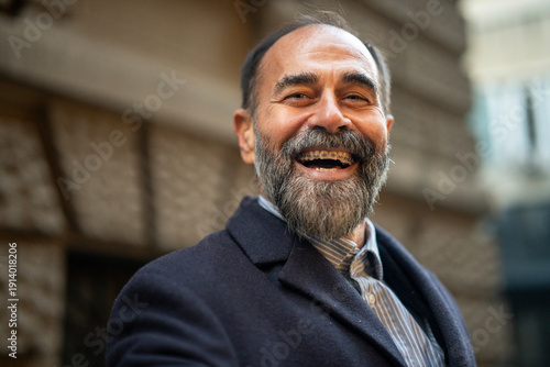 Tableau sur toile Mature man smiling widely showing dental braces
