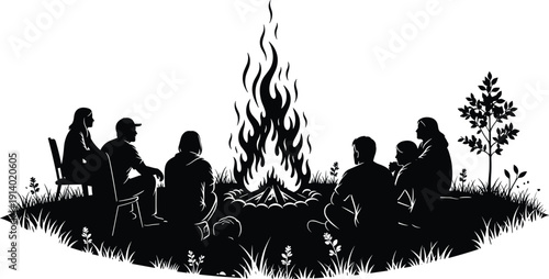 Black silhouette of a group of friends sitting around a large campfire at night in nature for camping outdoor adventure and summer bonfire concept