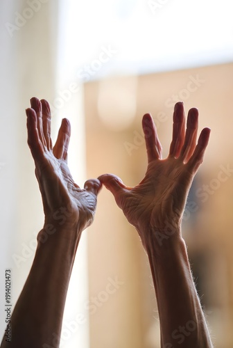 Mature Hands in Warm Sunlit Room