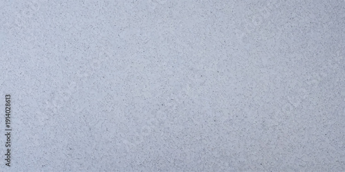 Light blue textured exterior wall surface, abstract pattern with subtle bumps for design backgrounds