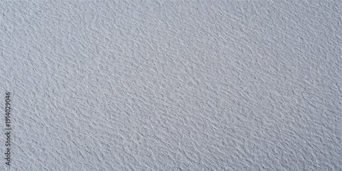Subtle grey textured concrete wall, abstract surface pattern with fine bumps for modern backgrounds