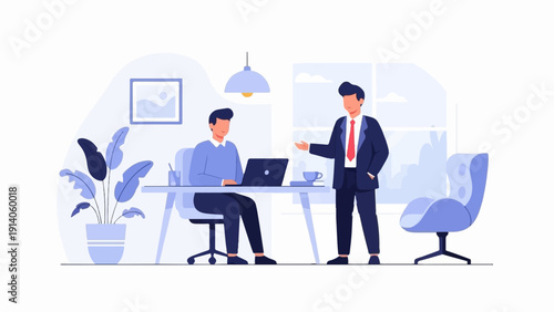 Two professional men in a modern office, one at a laptop while the other gestures in conversation