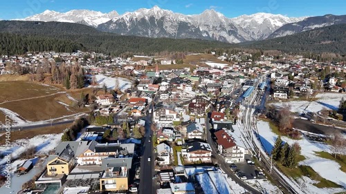 perspective sprawling alpine town seefeld tirol showcased dense tapestry traditional dark wood chalets white walled hotels town’s architectural variety drone austria 
