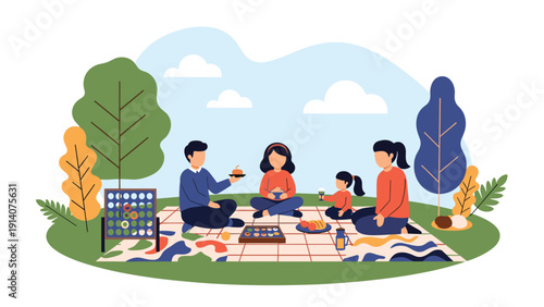 Happy family with parents and children enjoying picnic outdoors on green grass under trees with food and board game.