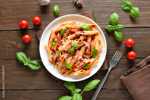 Italian penne pasta with tomato bolognese sauce on plate