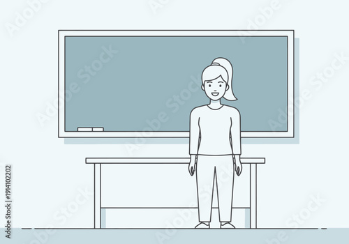Woman teacher standing in front of a blank classroom blackboard behind a desk ready for lesson and learning