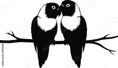 Two small lovebirds perch closely together on a tree branch silhouette.