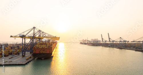 Photos Aerial view Container cargo ship loading unloading container import export sea port, Global trade business container cargo ship freight shipping commercial trade logistic transportation international