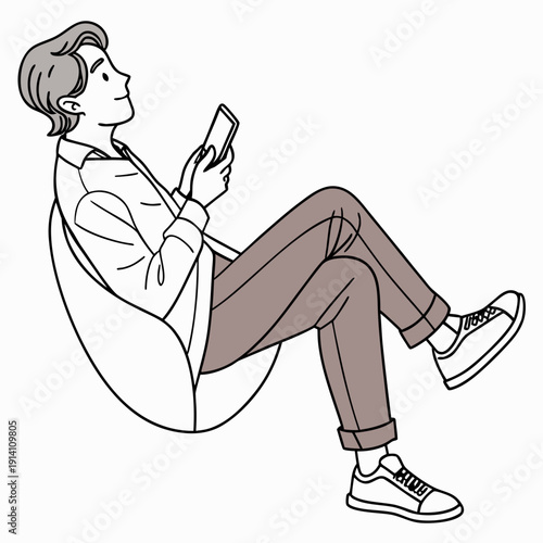 Relaxed man sitting in bean bag chair using smartphone