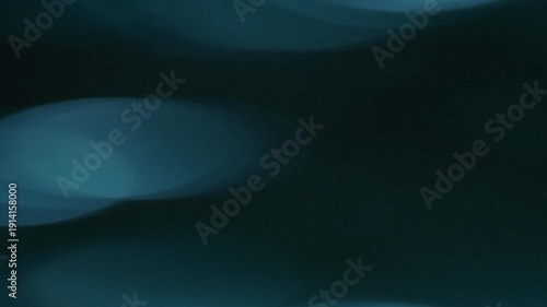Dynamic Light Leak Bokeh Transition with soft blue circles against a dark background, perfect for intros and overlays.