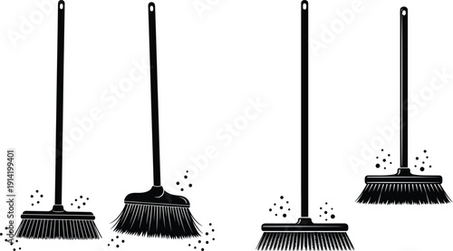 A group of brooms with bristles sweeping up debris