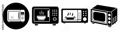 Set of modern black kitchen appliances microwave toaster oven kettle isolated on white background