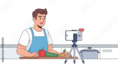 Man recording a cooking tutorial in a modern kitchen with fresh vegetables on the counter from a front viewpoint