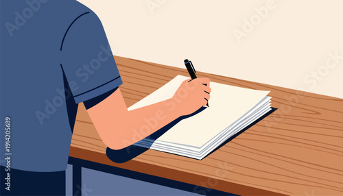 Person wearing blue shirt writing in notebook on wooden desk