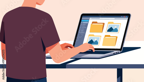 Person interacting with a laptop displaying folders with landscape images