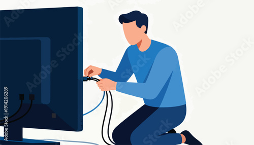 Person kneeling, connecting cables to a large screen