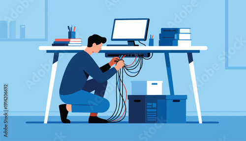 Person crouched under desk organizing tangled computer cables