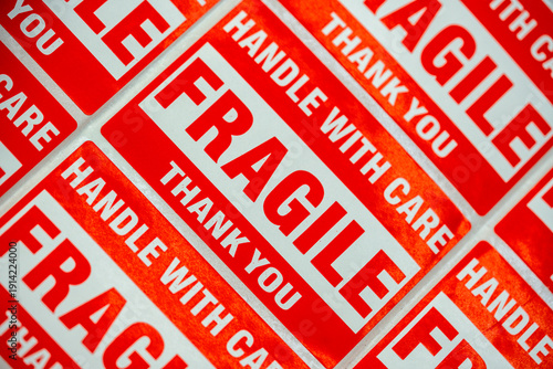 Fragile labels on packaging indicating careful handling required to protect contents during shipping and delivery