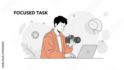 Photographer Focused on Task with Camera and Laptop