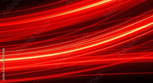 Abstract fiery red light trails evoking energy, speed, and dynamism in a dark background