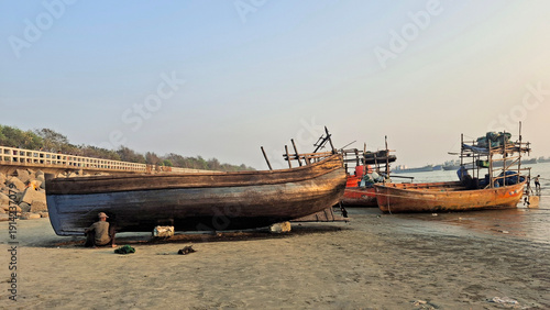Slika na platnu Fishing boats in Chittagong sail across the vast waters of the Bay of Bengal, carrying local fishermen who depend on the sea for their livelihood