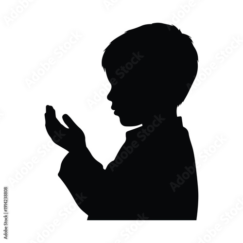 Silhouetted child in prayer or contemplation with hands cupped