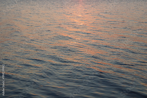 Photography Sunset light reflection on calm water surface background