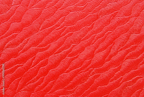 Fotografie Abstract red texture, clean red waved structural surface as background