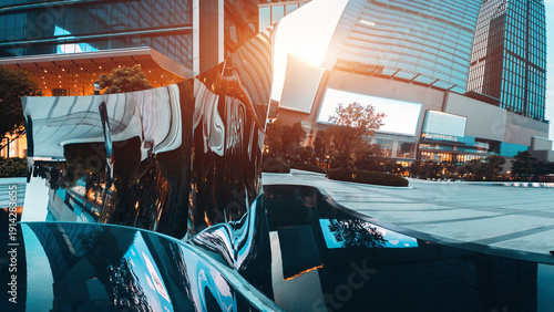 Modern urban architecture of Bangkok reflected in distorted mirror sculpture with skyscrapers and city lights, Contemporary cityscape with reflective art object and glass towers in financial district