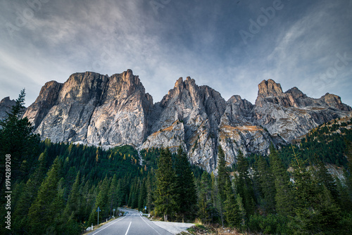 Tableau sur toile Mountain road next to the beautiful mountain peaks at autumn in the Dolomites