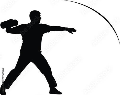 Man in dynamic pose throwing a frisbee with perfect form and technique in a silhouette image