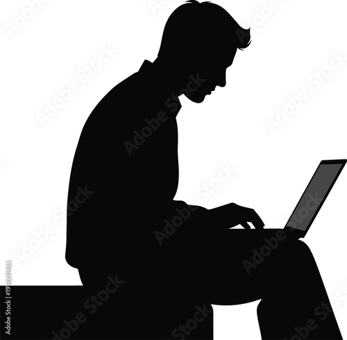 Man sitting on a bench using a laptop with focused attention on the screen