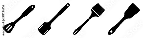 Set of four black kitchen spatulas isolated on white background for cooking and baking tools