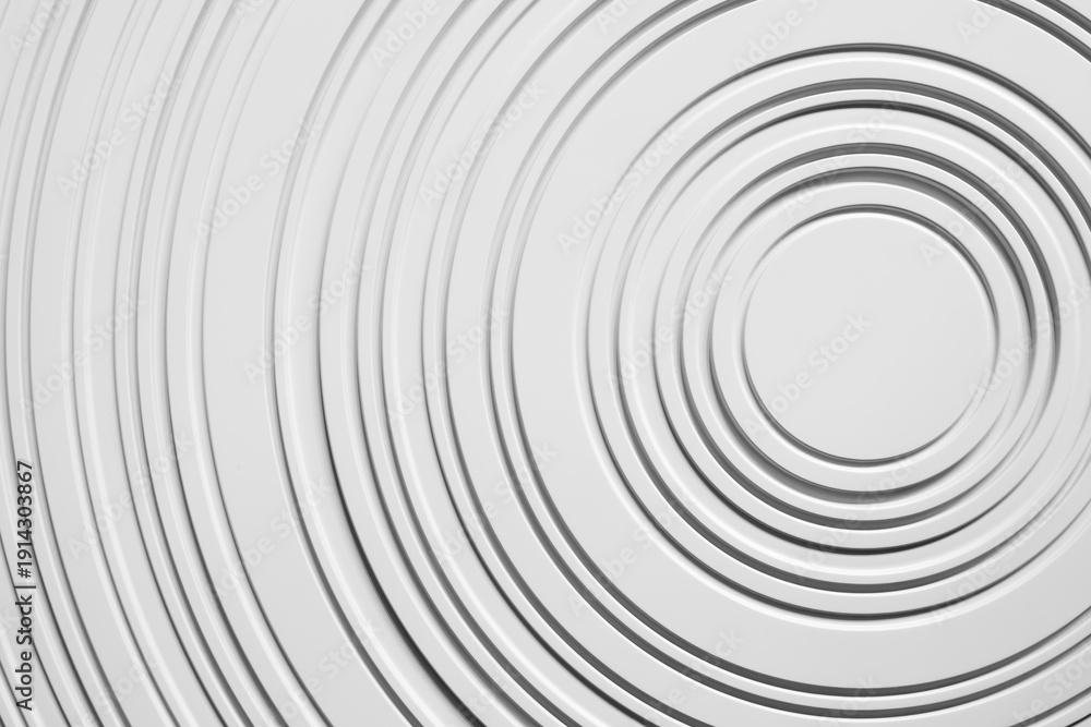 Obraz premium image is white circle with gray background. circle is surrounded by series of smaller circles, creating sense of depth and movement