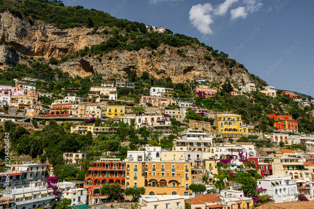 Fototapeta premium Iconic village of Positano Italy with main cathedral and colorful old buildings on the cliffs of the Amalfi Coast